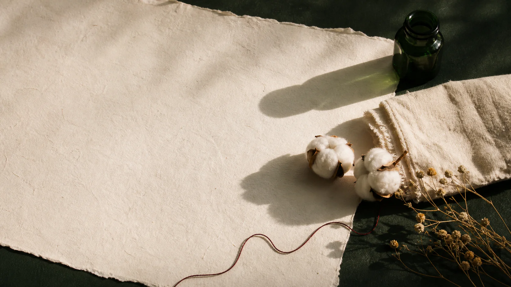Cotton, natural cloth, and tactile paper in warm light